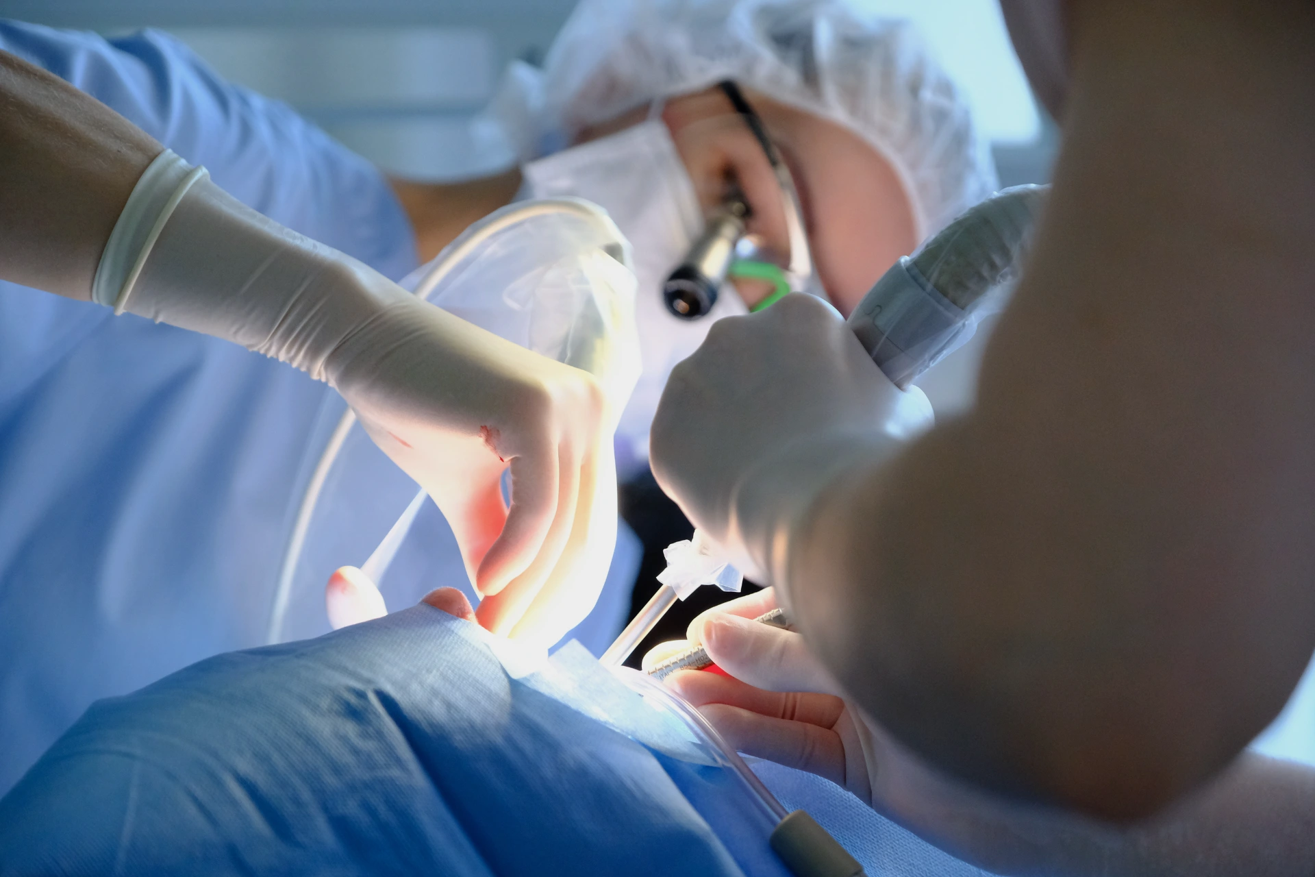 Doctor and assistant during implant placement in a dental clinic