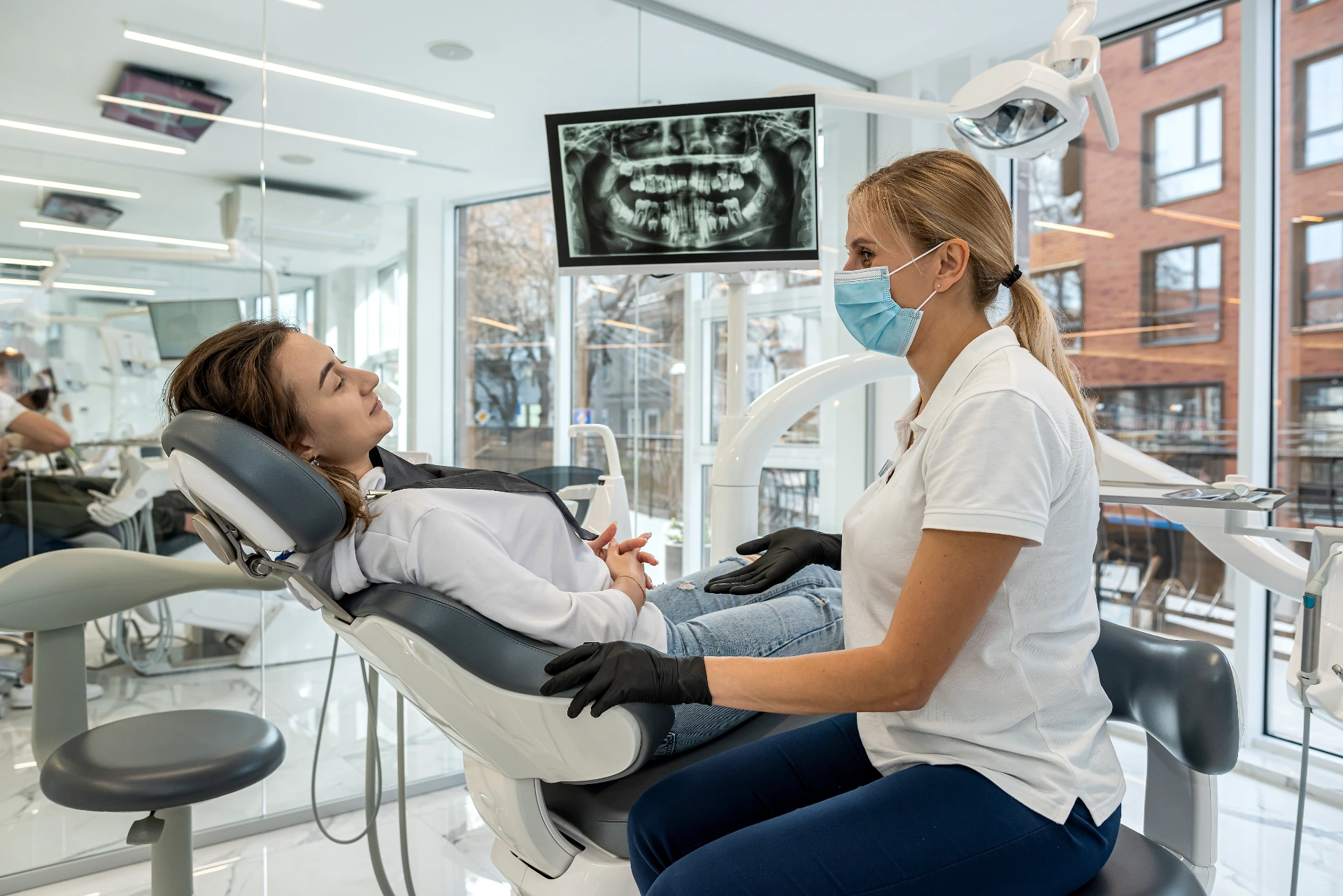 Dentist and patient choose treatment during consultation with medical equipment in dentistry. the right solution for the treatment of the oral cavity