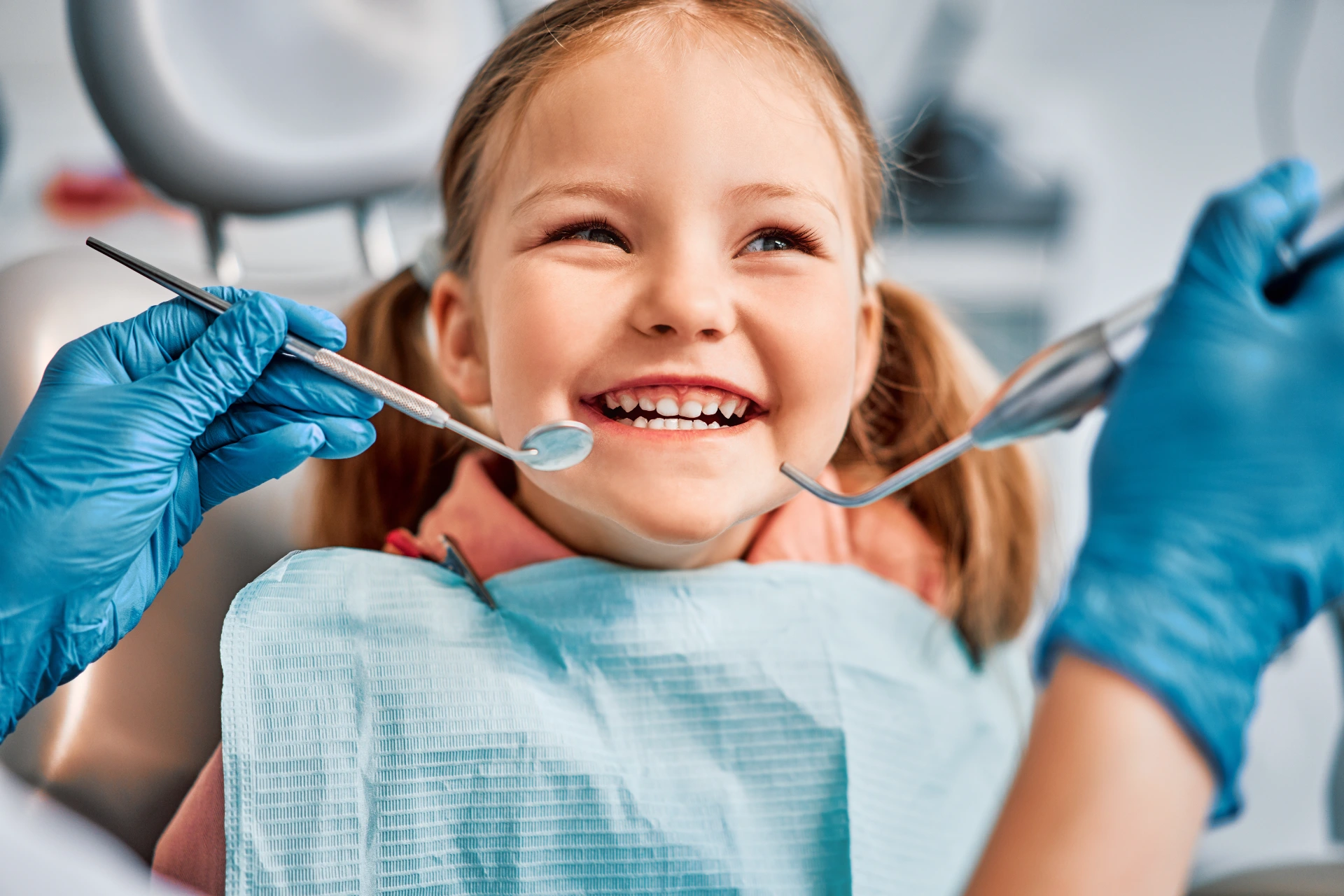 Children's dentistry. Live funny photo of a laughing child at the dentist's appointment.